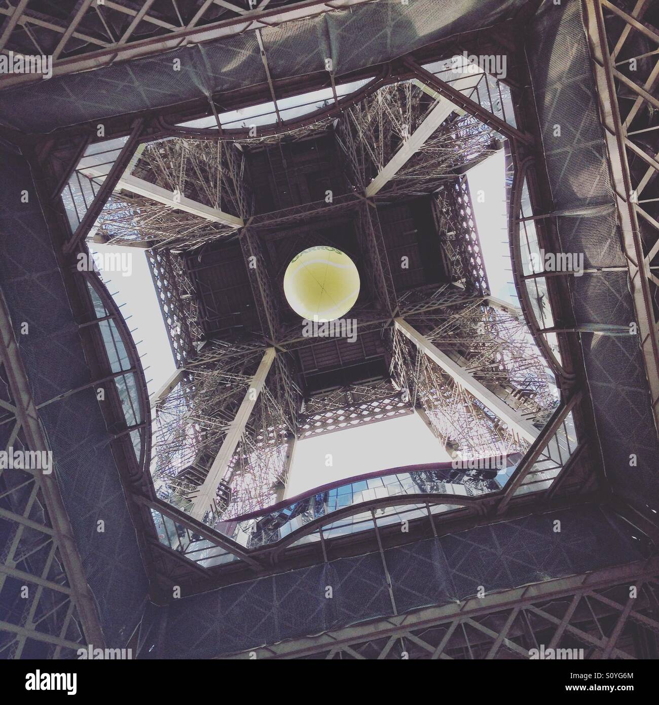 Roland Garros tennis ball up the Eiffel Tower Stock Photo