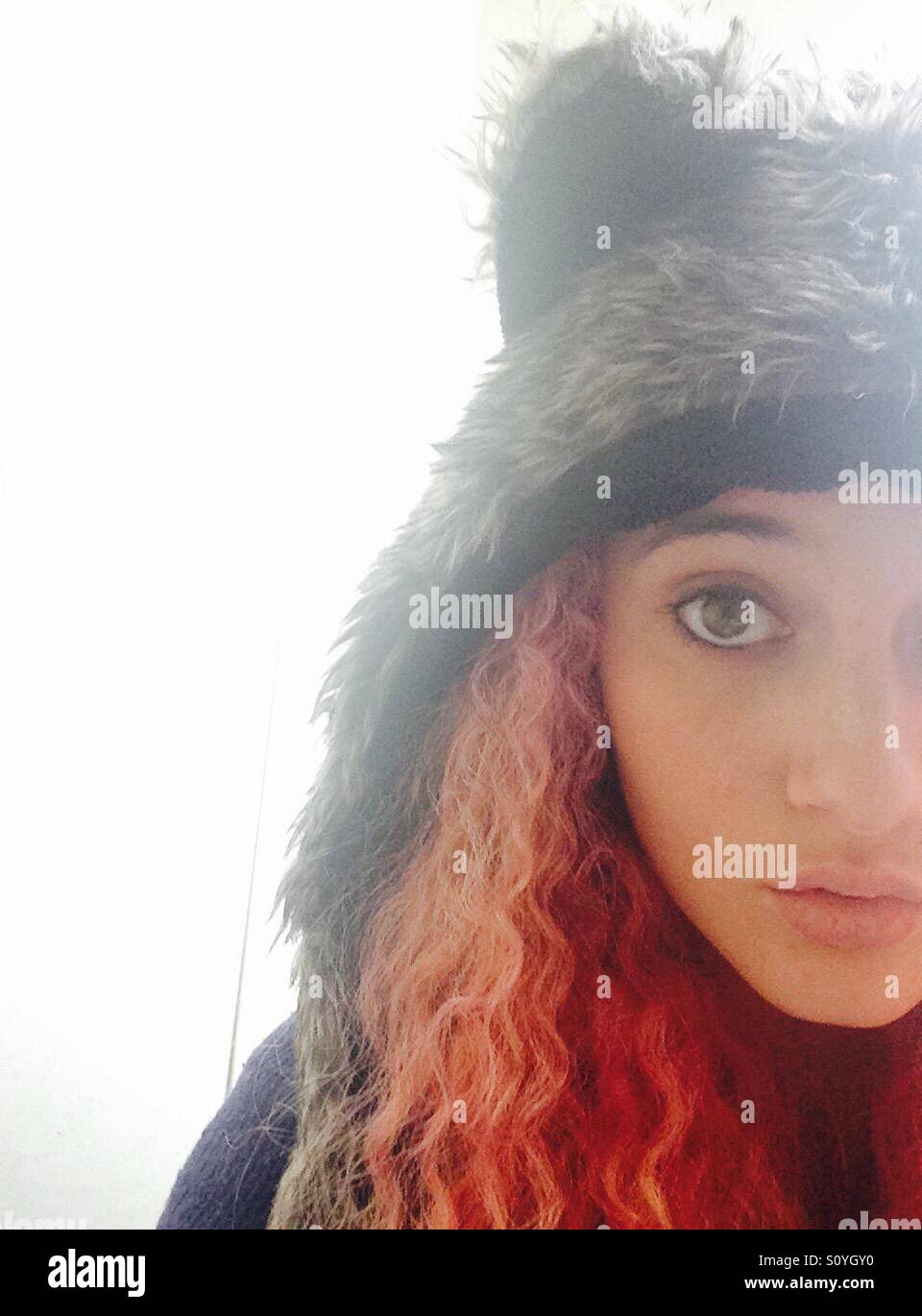 Wolf hat and pink hair Stock Photo