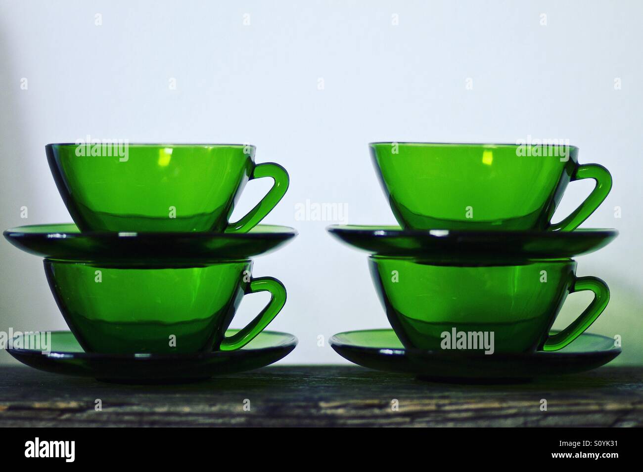Green glass teacups stacked Stock Photo
