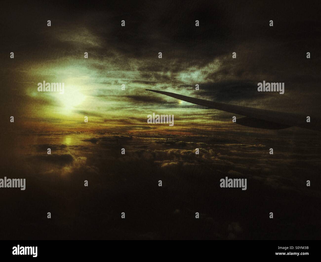 Sunset from airplane with Wing in photo - Smartphone Captured Stock Image