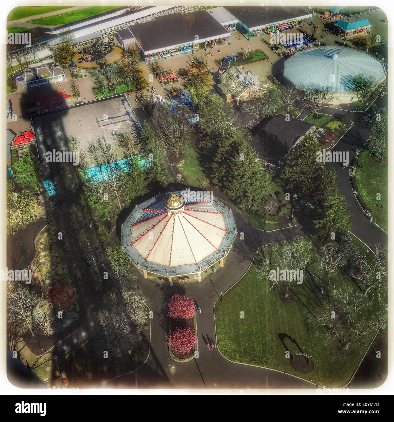 The Eiffel Tower throws a large shadow on Kings Island Amusement Park. - Smartphone Captured Stock Image