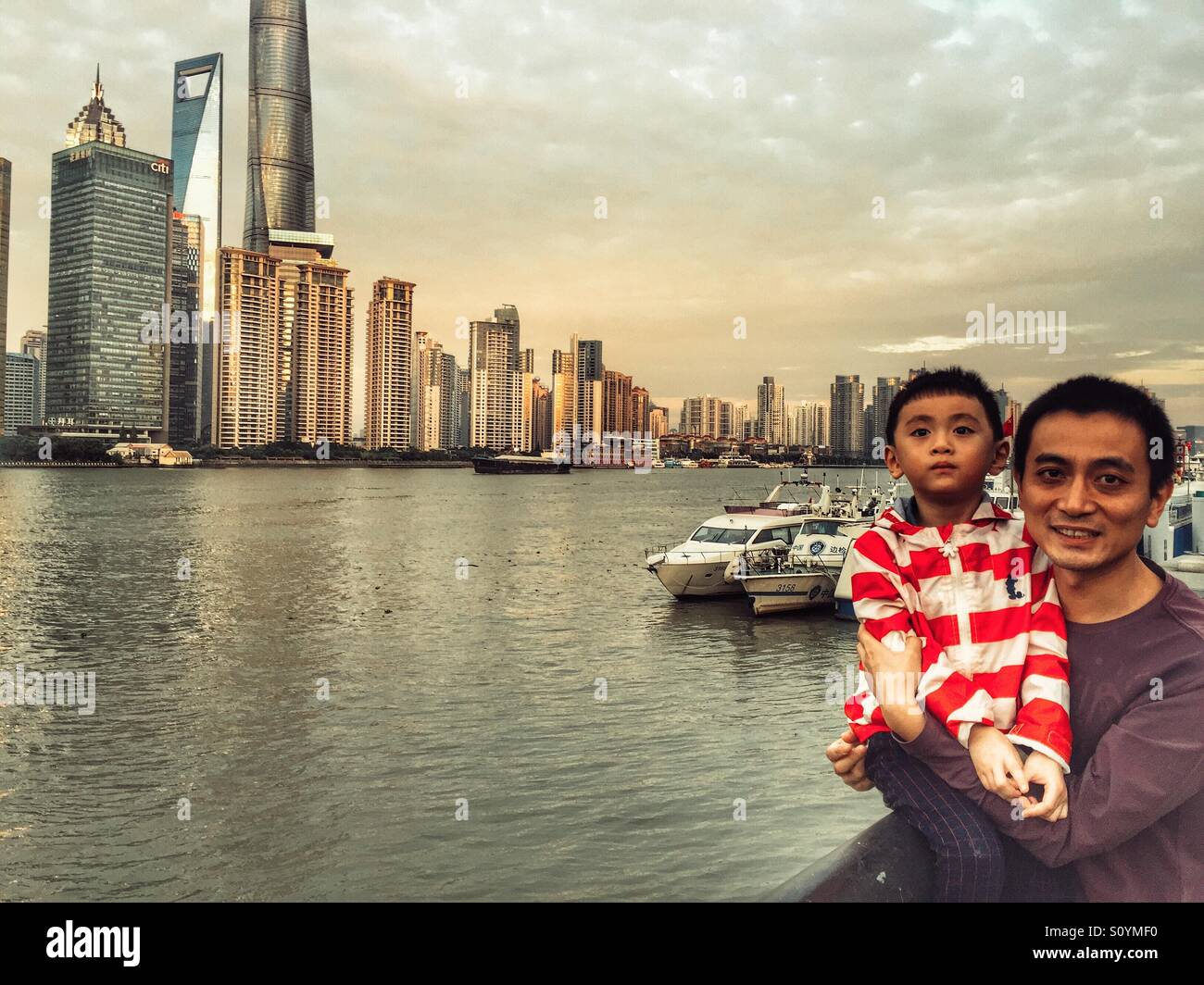 Father and son tourists in Shanghai China - Smartphone Captured Stock Image