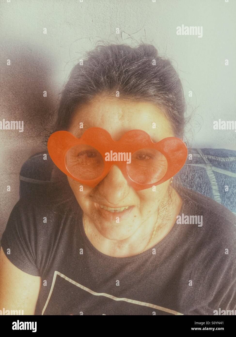 Mature woman with funny sunglasses - Smartphone Captured Stock Image