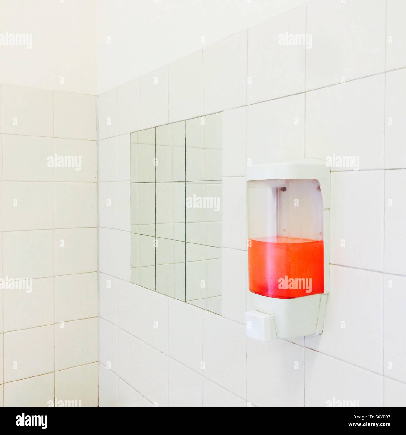Red soap dispenser Stock Photo Alamy