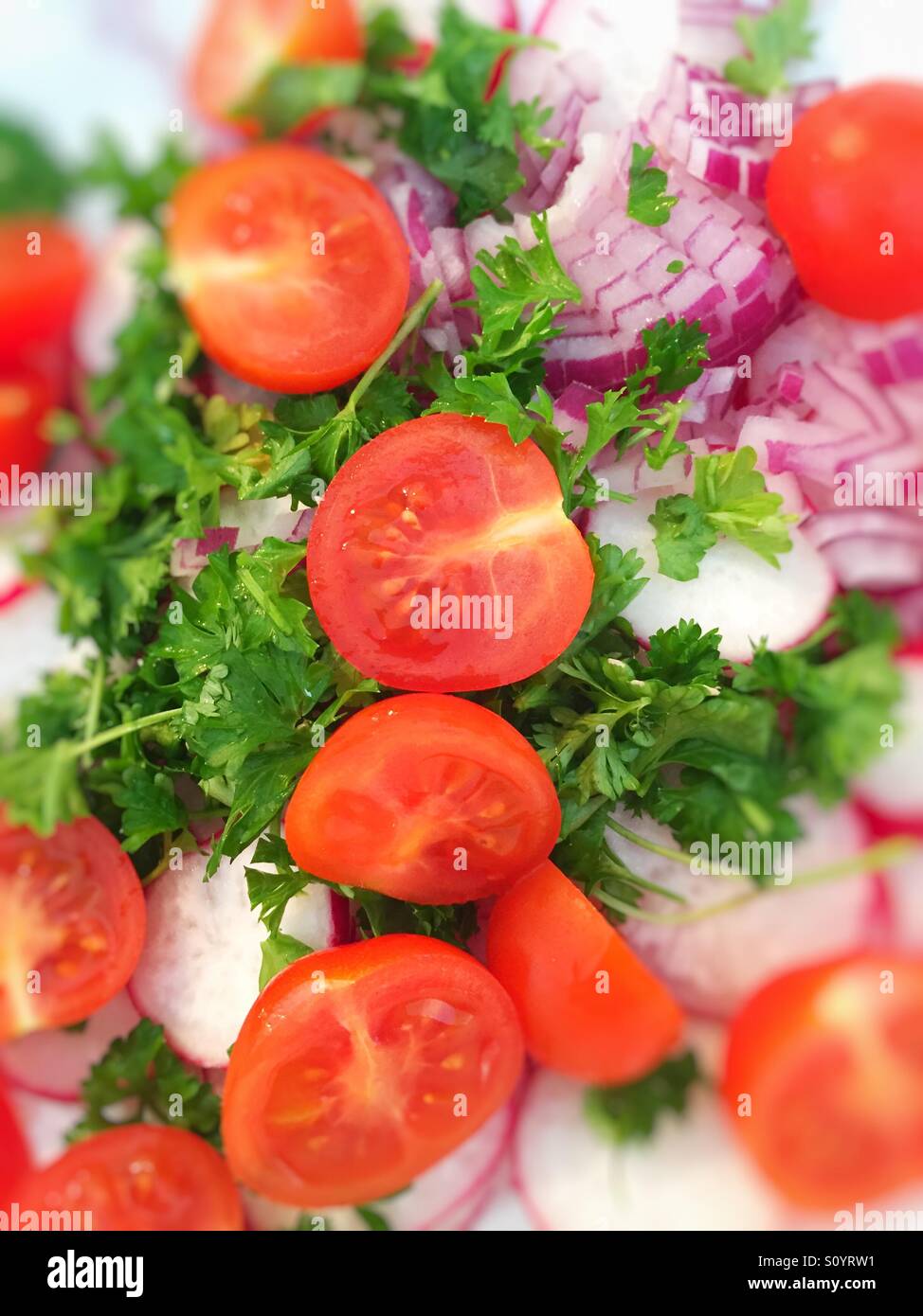 Tomato salad with parsley and red onion Stock Photo Alamy