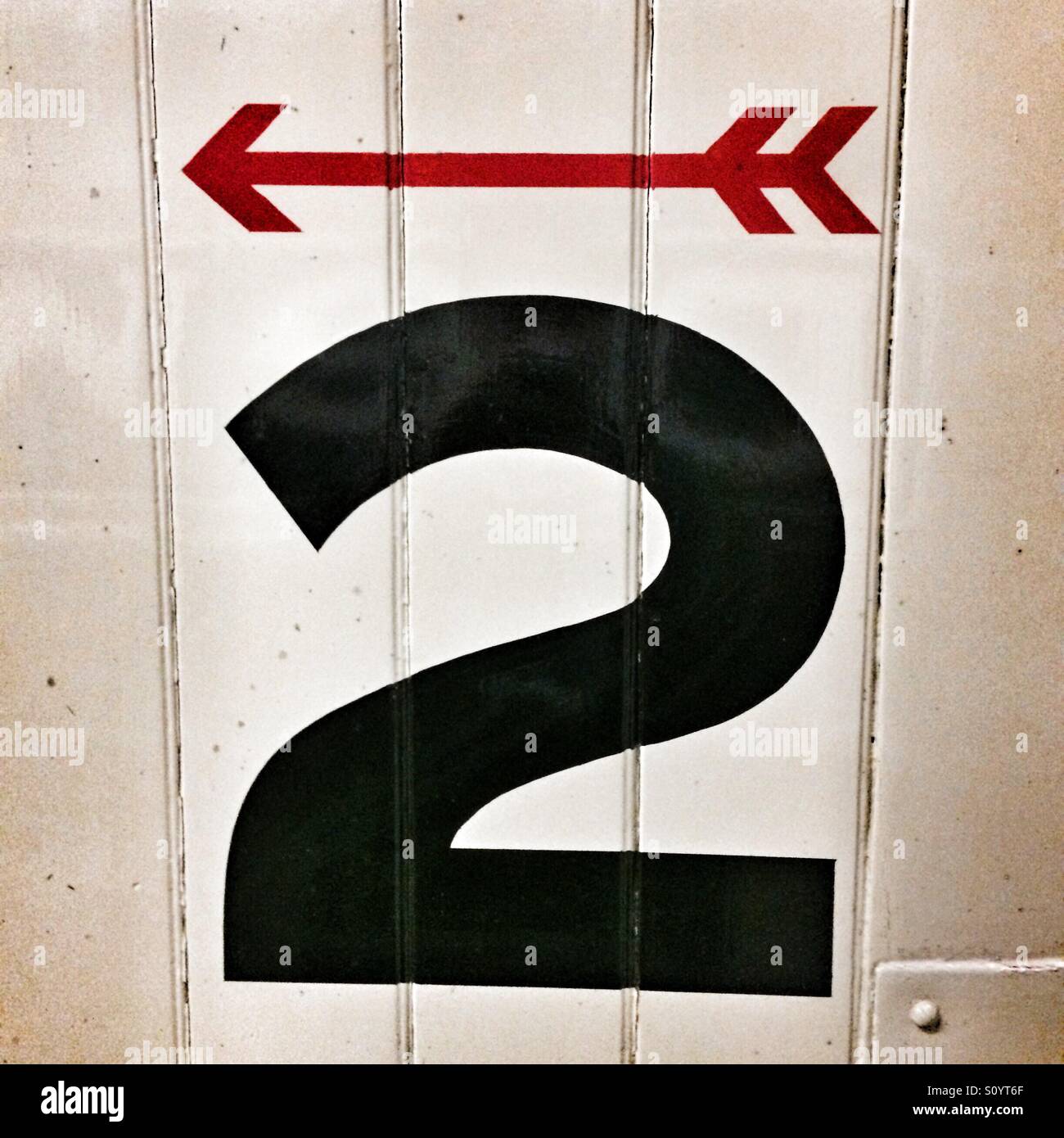 Direction arrow and the number 2 - Smartphone Captured Stock Image