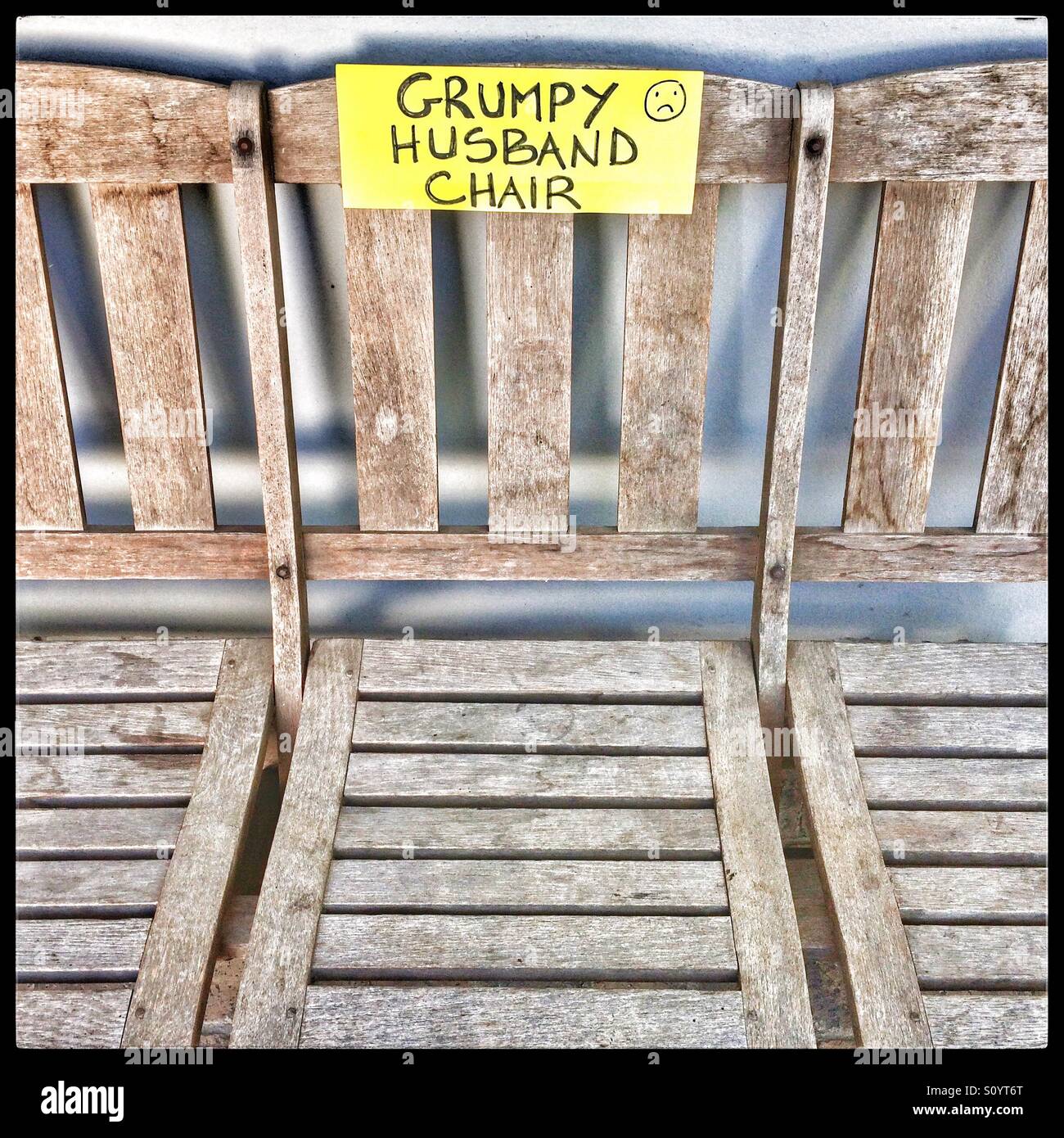 Grumpy husband chair sign Stock Photo Alamy