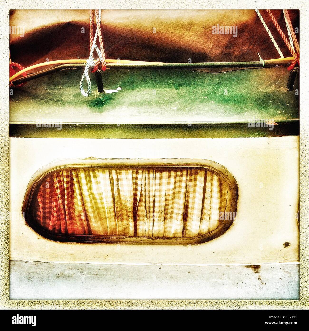 Narrowboat window with curtain close up - Smartphone Captured Stock Image