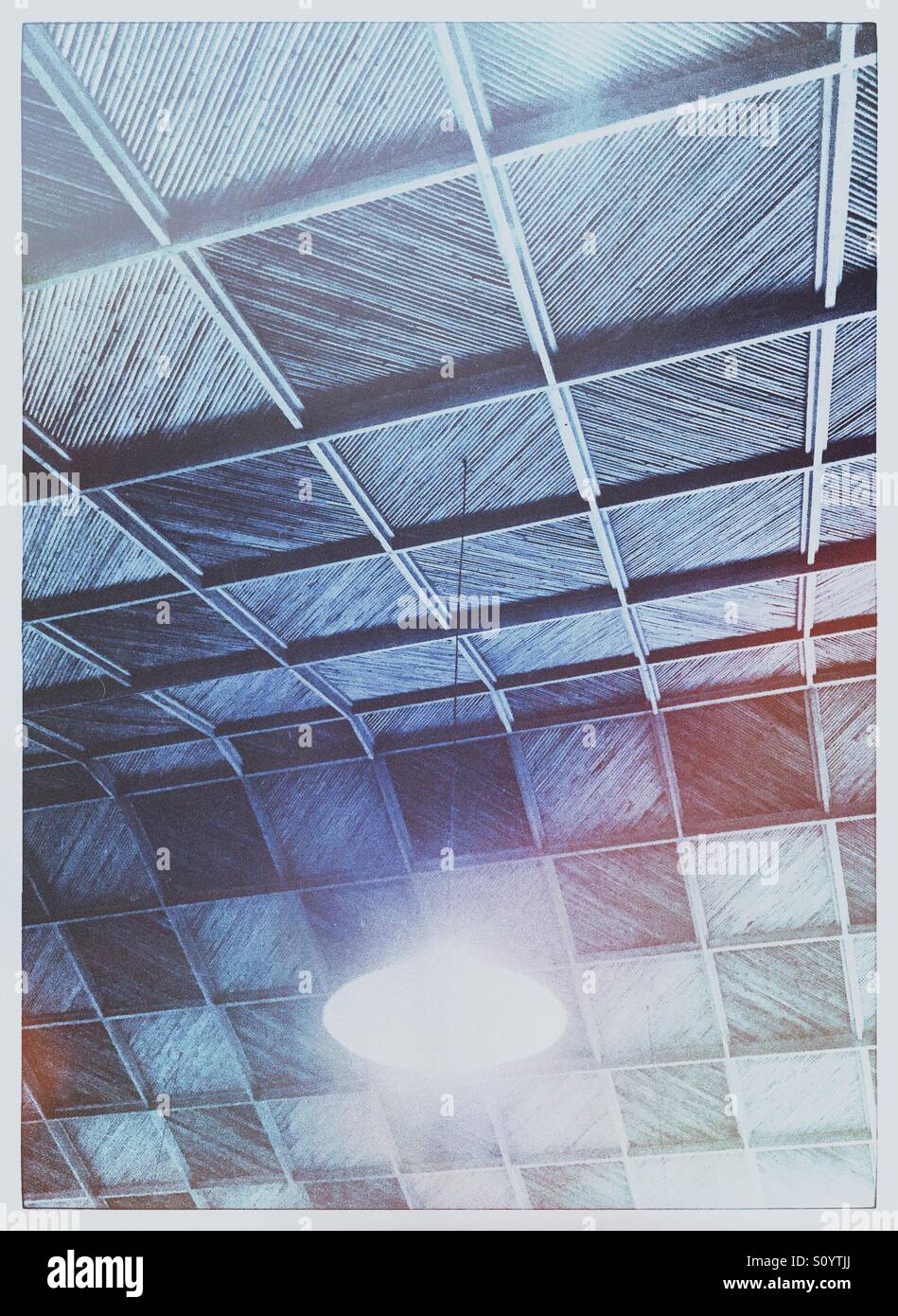 Ceiling light hanging from a bamboo and wood ceiling - Smartphone Captured Stock Image