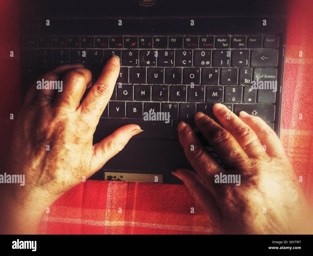 Elderly woman using computer - Smartphone Captured Stock Image
