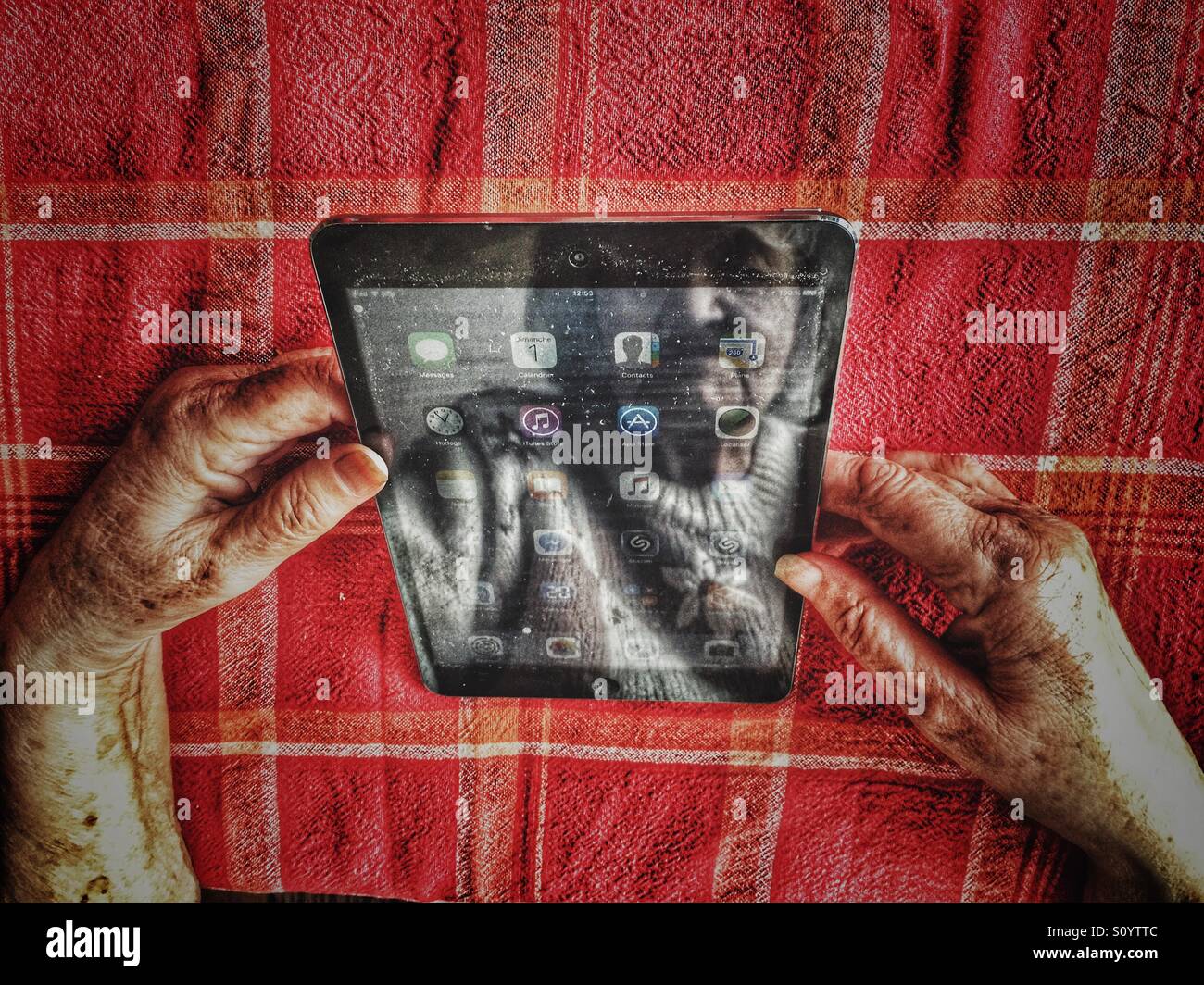 Elderly woman using iPad - Smartphone Captured Stock Image
