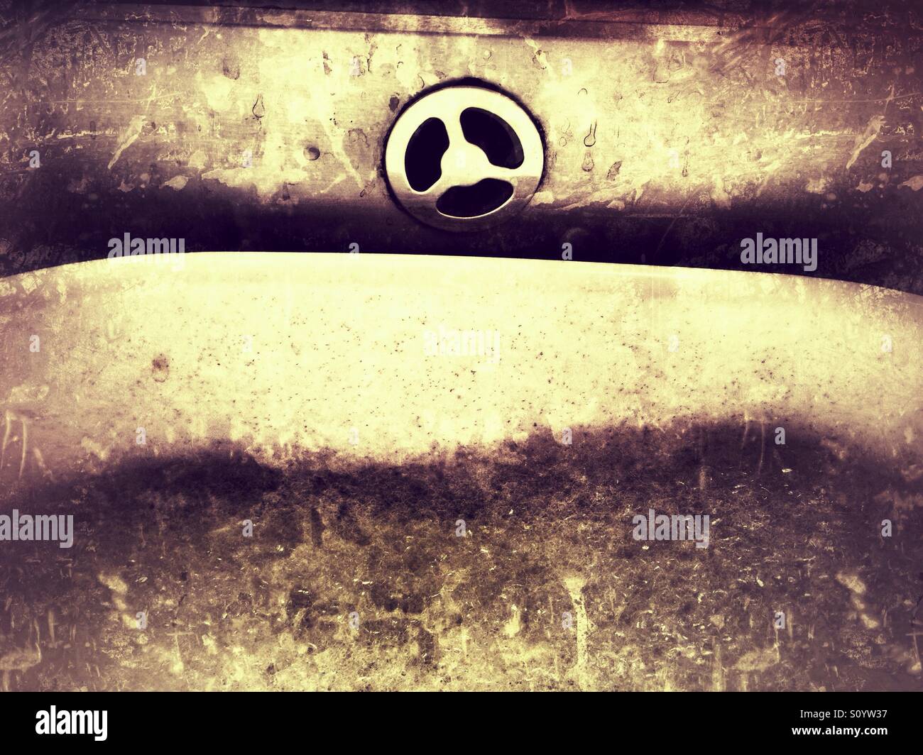 Soap bubbles and bowl in kitchen sink with overflow - Smartphone Captured Stock Image