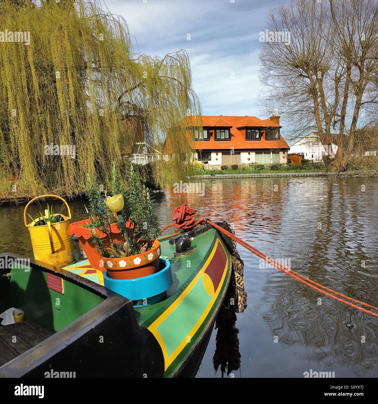 A narrowboat moored on the Grand Union Canal near Uxbridge in West London. Stock Photo