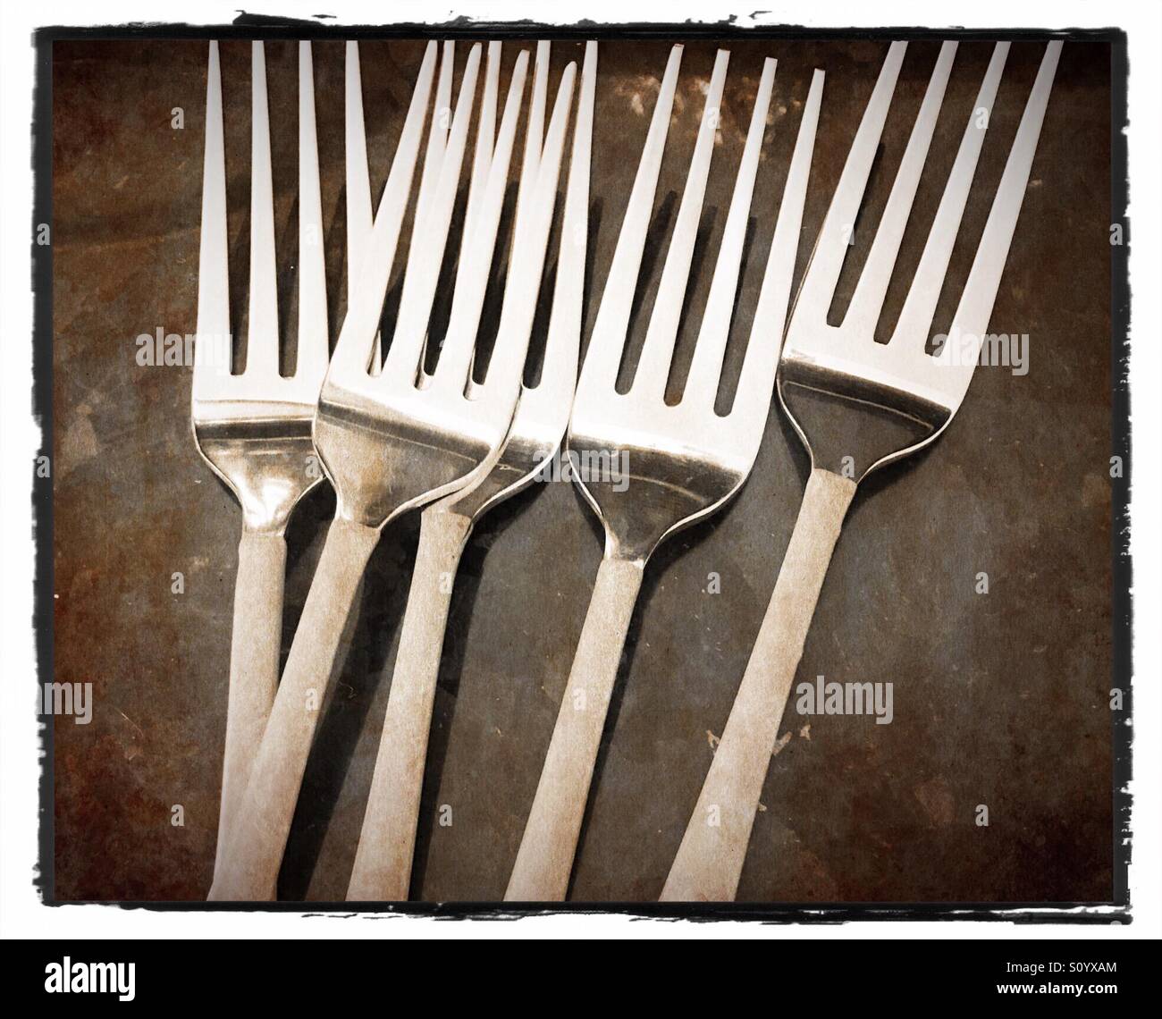 Forks in a row silver cutlery Stock Photo