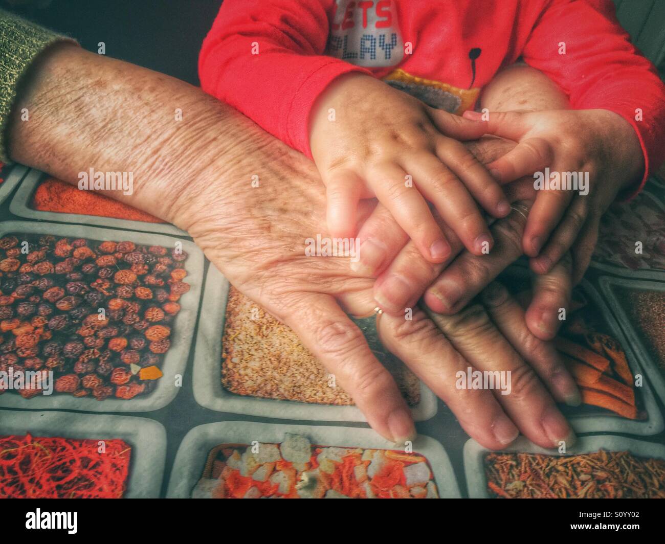 Grandmother and baby hands - Smartphone Captured Stock Image