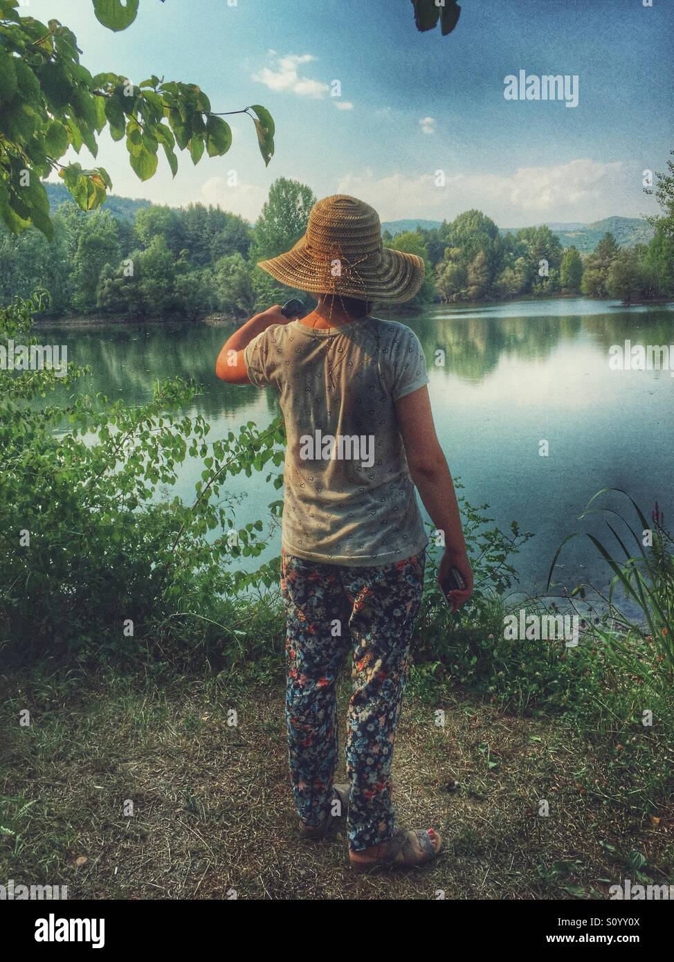 Rear view of woman in the nature - Smartphone Captured Stock Image