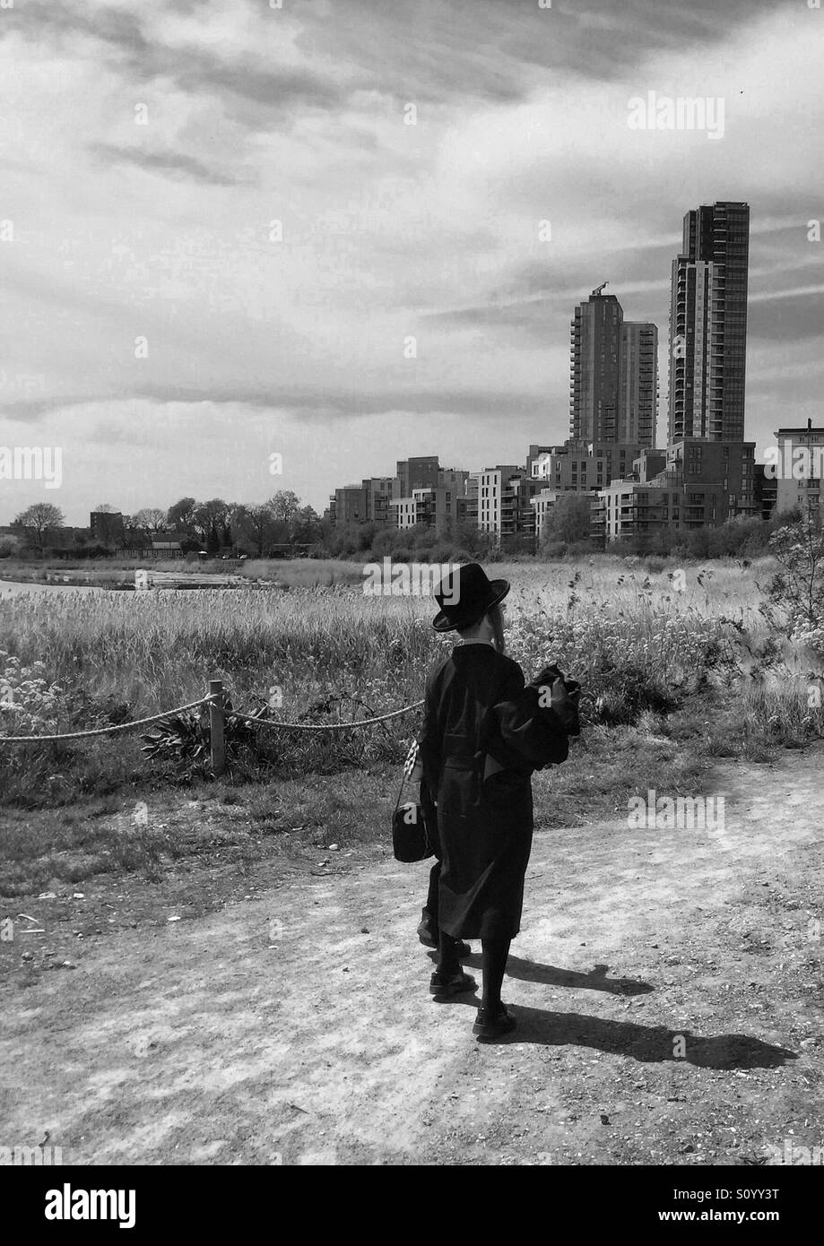 Young orthodox Jewish man walking on Woodberry wetlands, Hackney , London, U.K. Stock Photo
