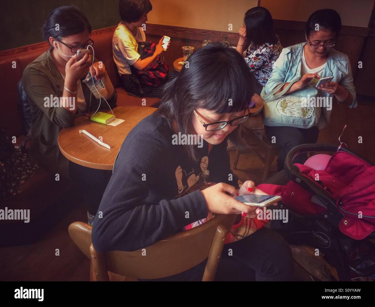 Chineses using mobile phone - Smartphone Captured Stock Image