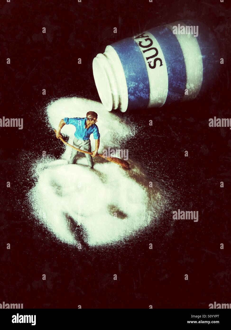 Man sweeping up sugar - Smartphone Captured Stock Image