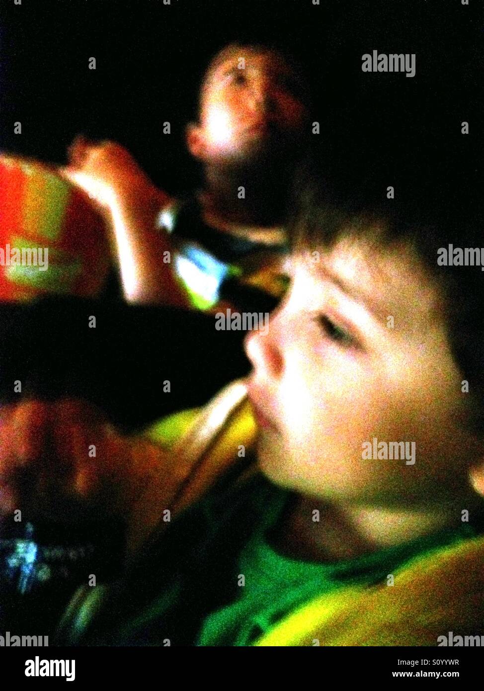 Two boys in the cinema. - Smartphone Captured Stock Image