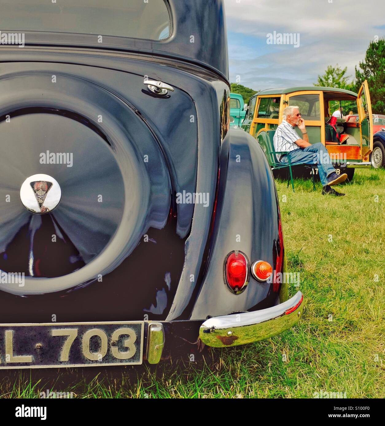 Relaxing at a classic car show in England UK - Smartphone Captured Stock Image