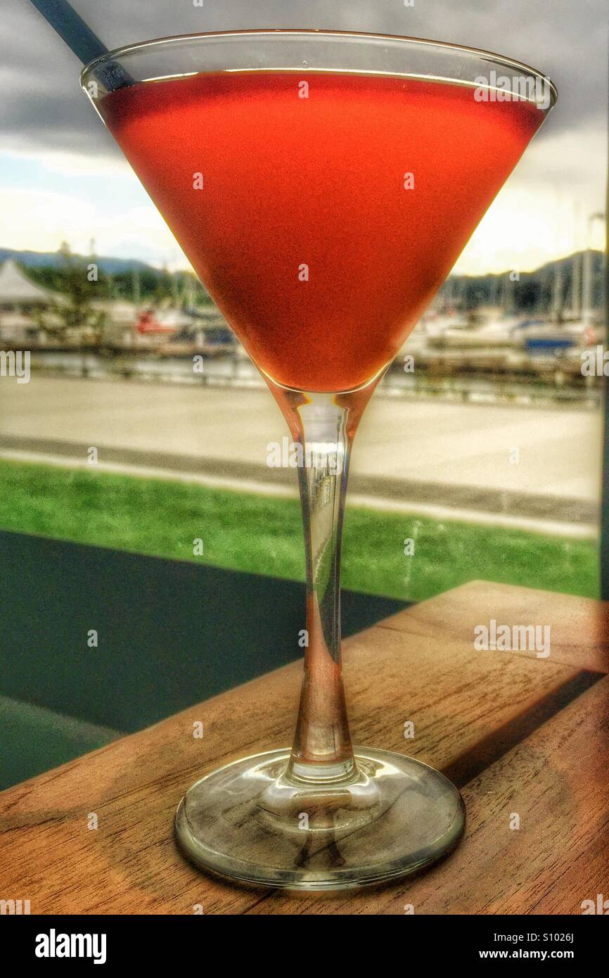 Cocktail sitting on a patio table. - Smartphone Captured Stock Image