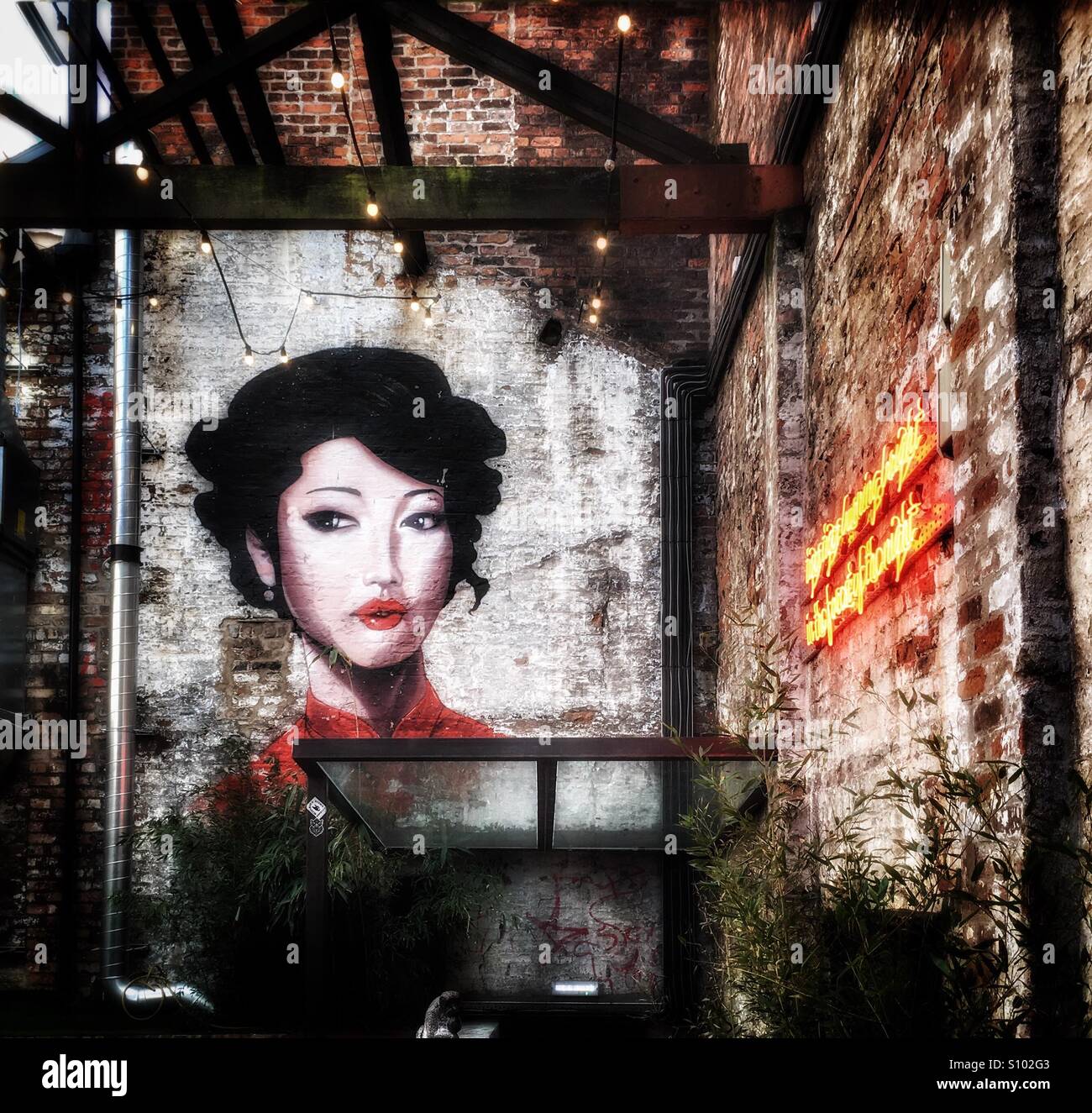 Painted mural of beautiful oriental woman hires stock photography and