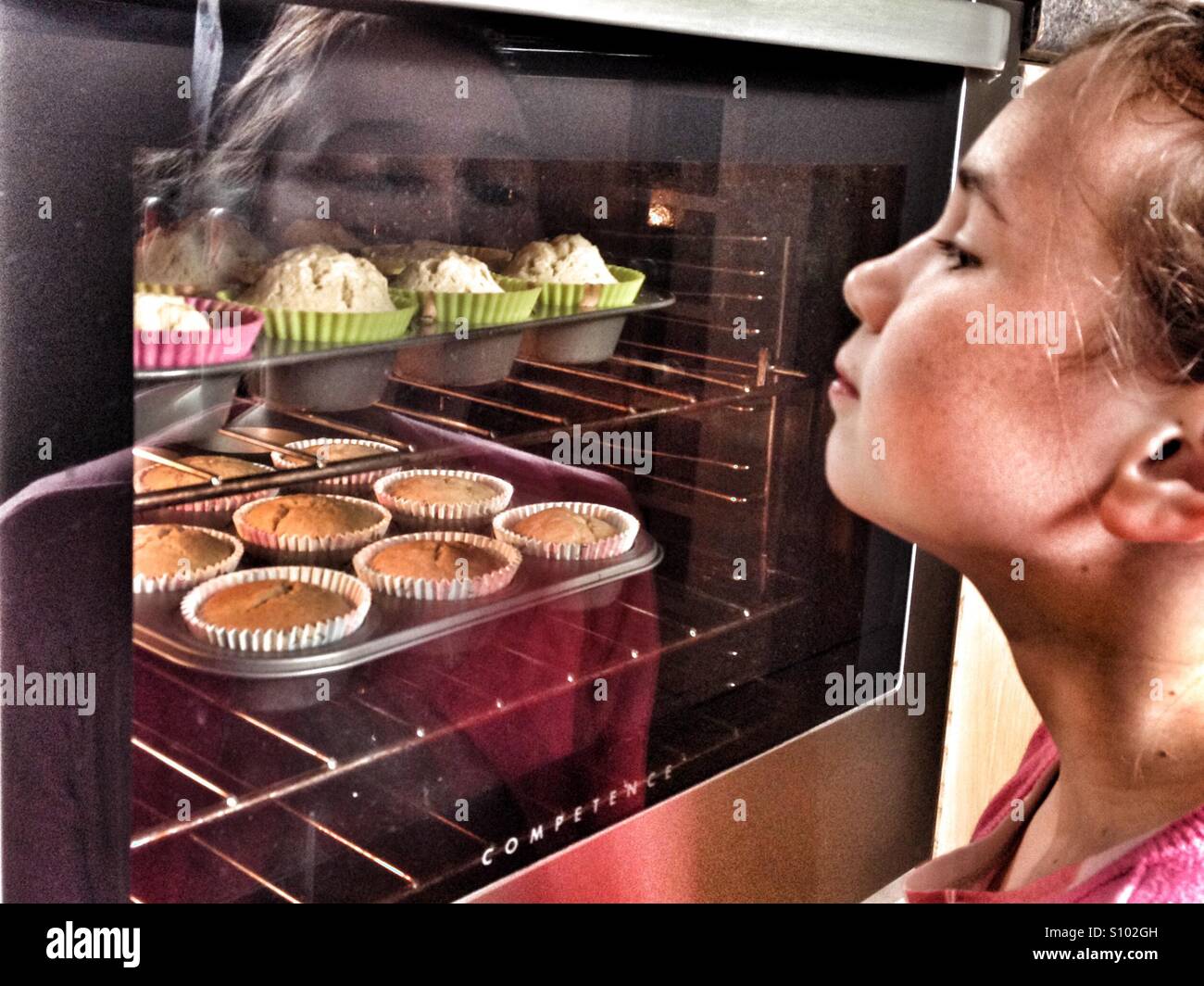 Watching cakes rise Stock Photo - Alamy