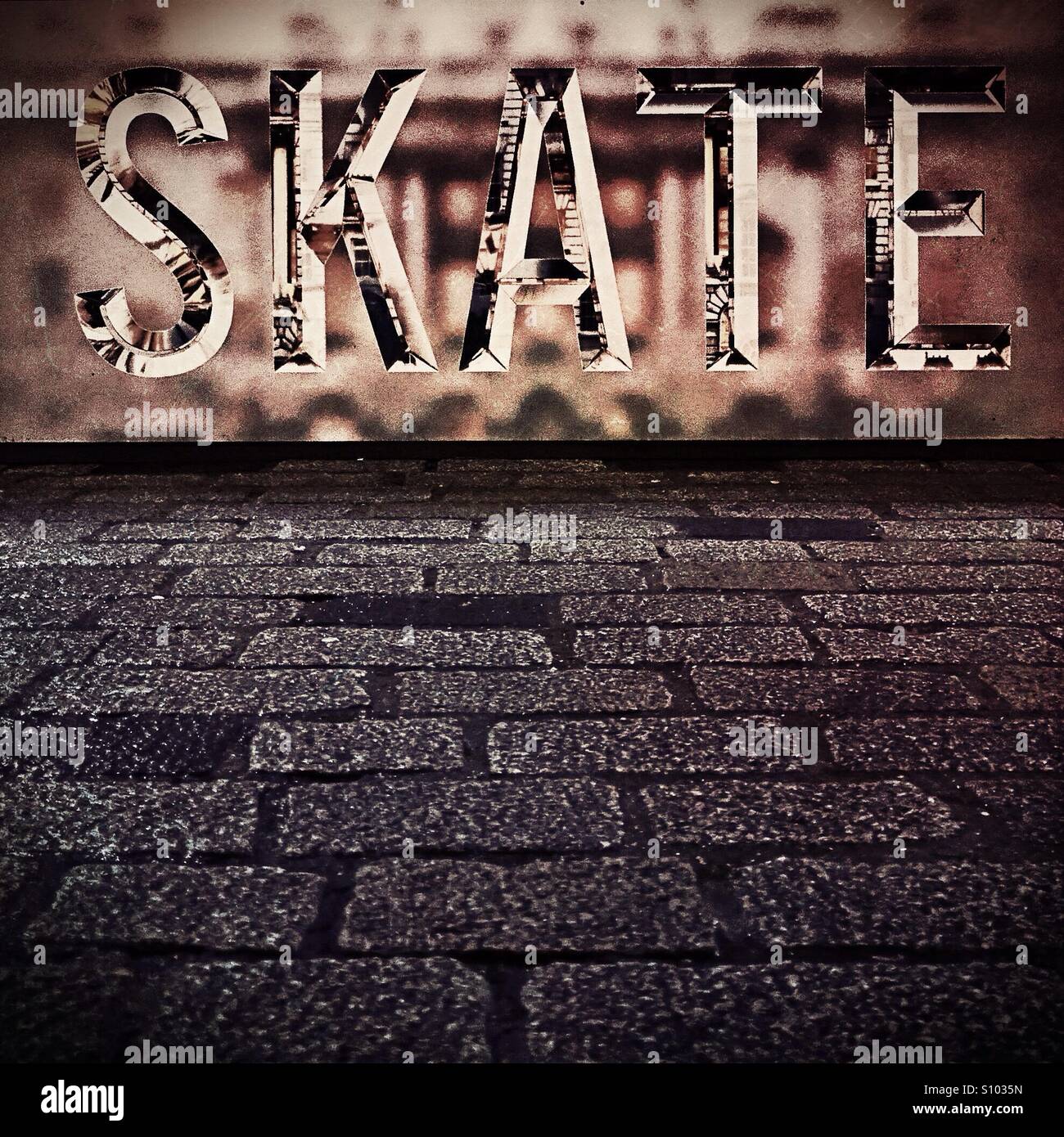 The word skate in urban setting Stock Photo