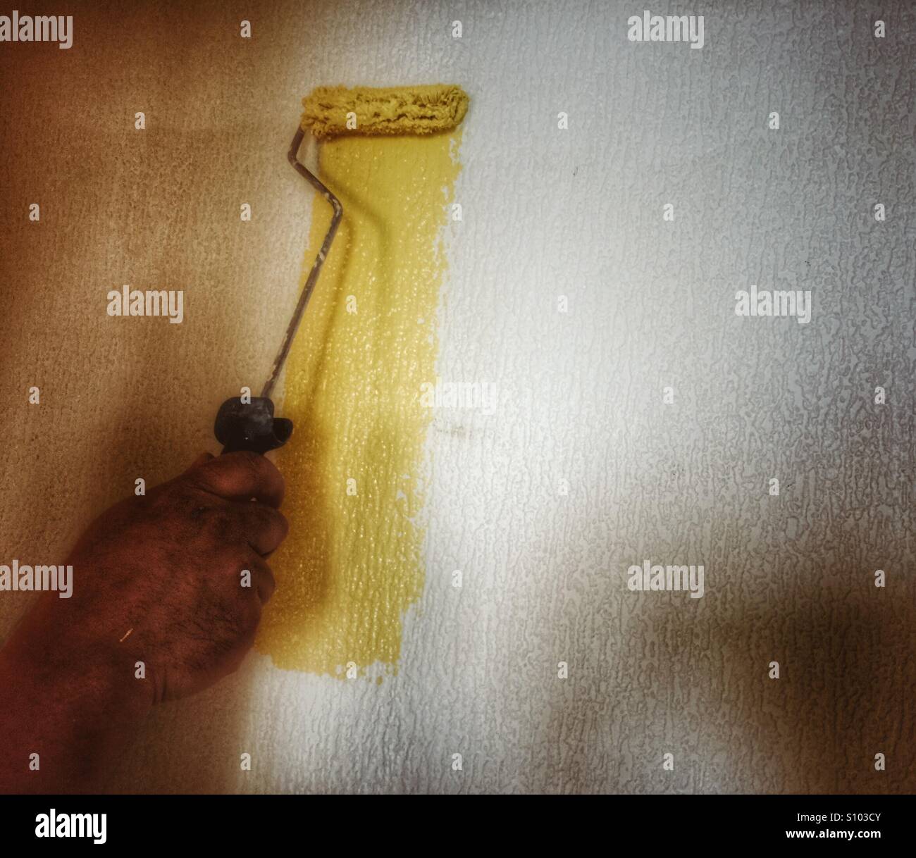 Man painting wall - Smartphone Captured Stock Image