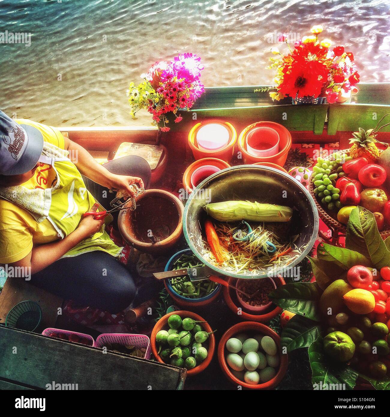 Food being prepared on a boat at the Taling Chan floating market, Bangkok, Thailand - Smartphone Captured Stock Image