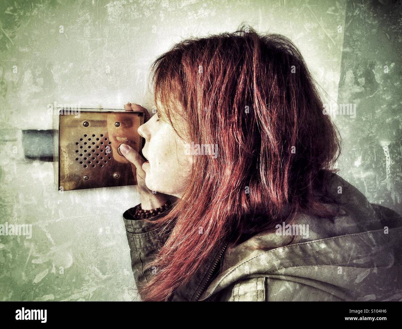 Woman talking on the intercom - Smartphone Captured Stock Image