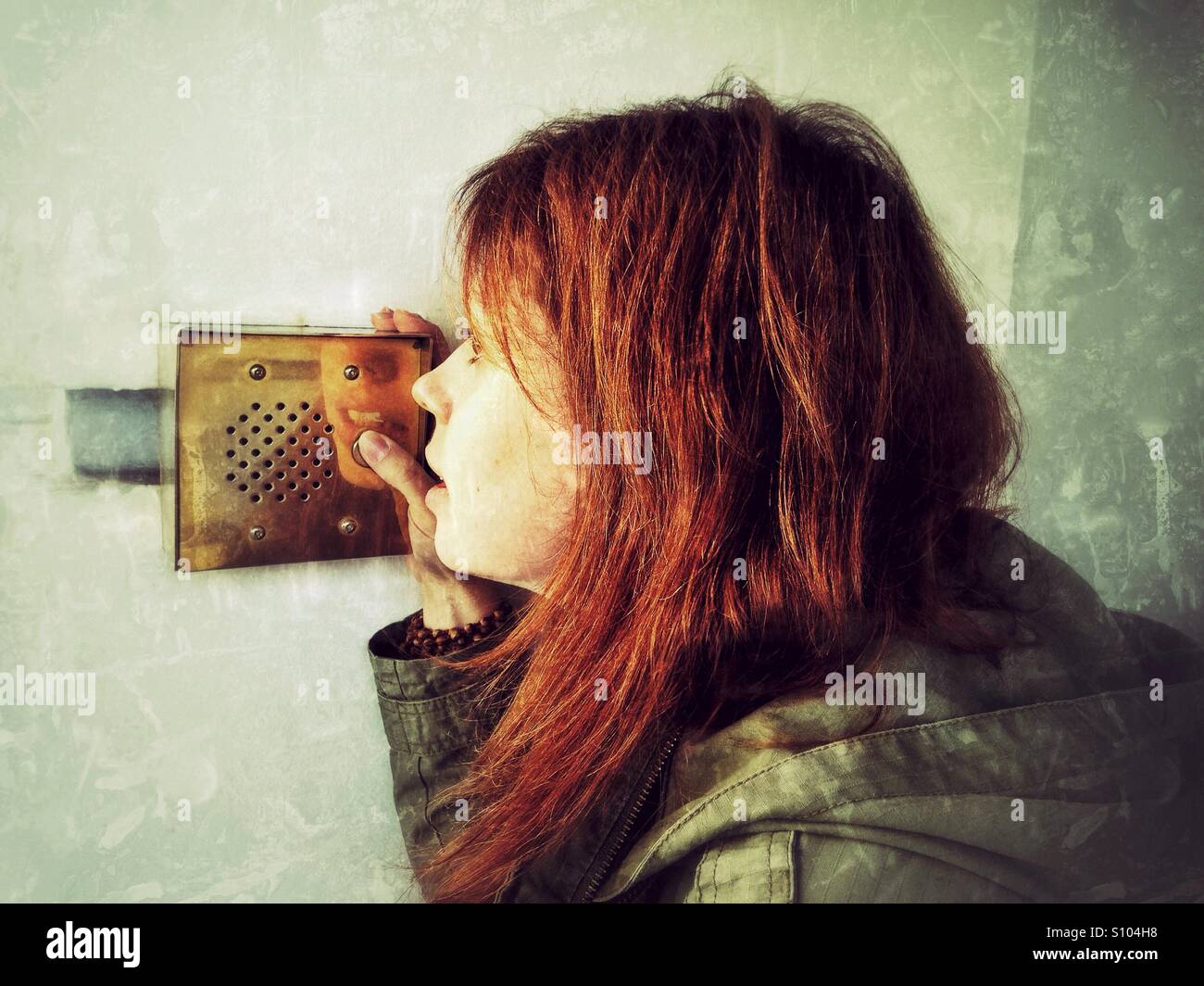 Woman talking on the intercom - Smartphone Captured Stock Image