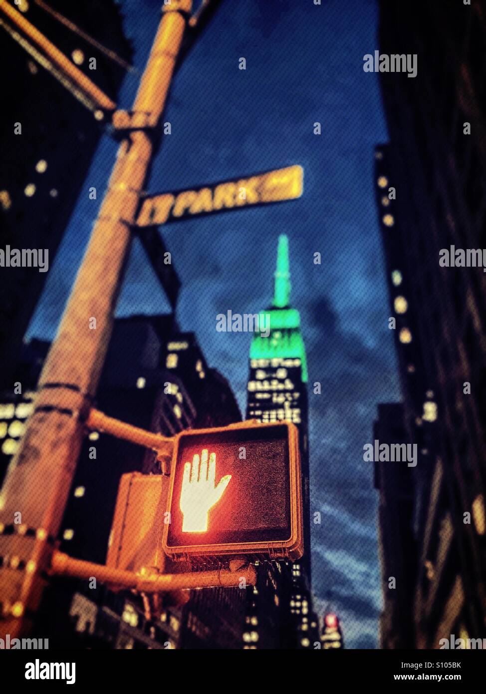 Don't walk sign on 34th St. in Midtown Manhattan with the Empire State building in the background - Smartphone Captured Stock Image