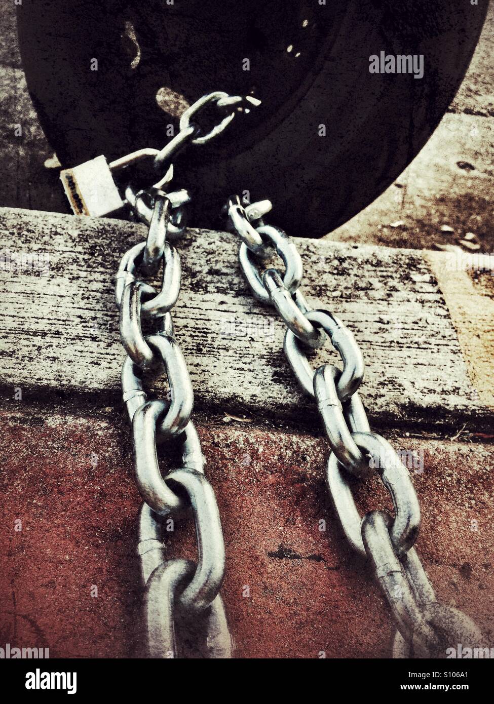 Chained motor scooter - Smartphone Captured Stock Image