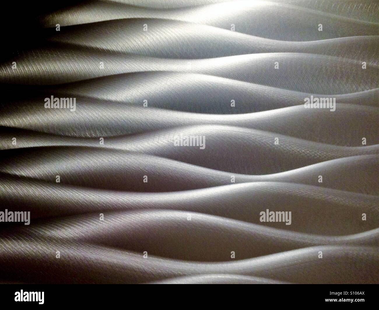 Flowing abstract in soft metallic silver - Smartphone Captured Stock Image
