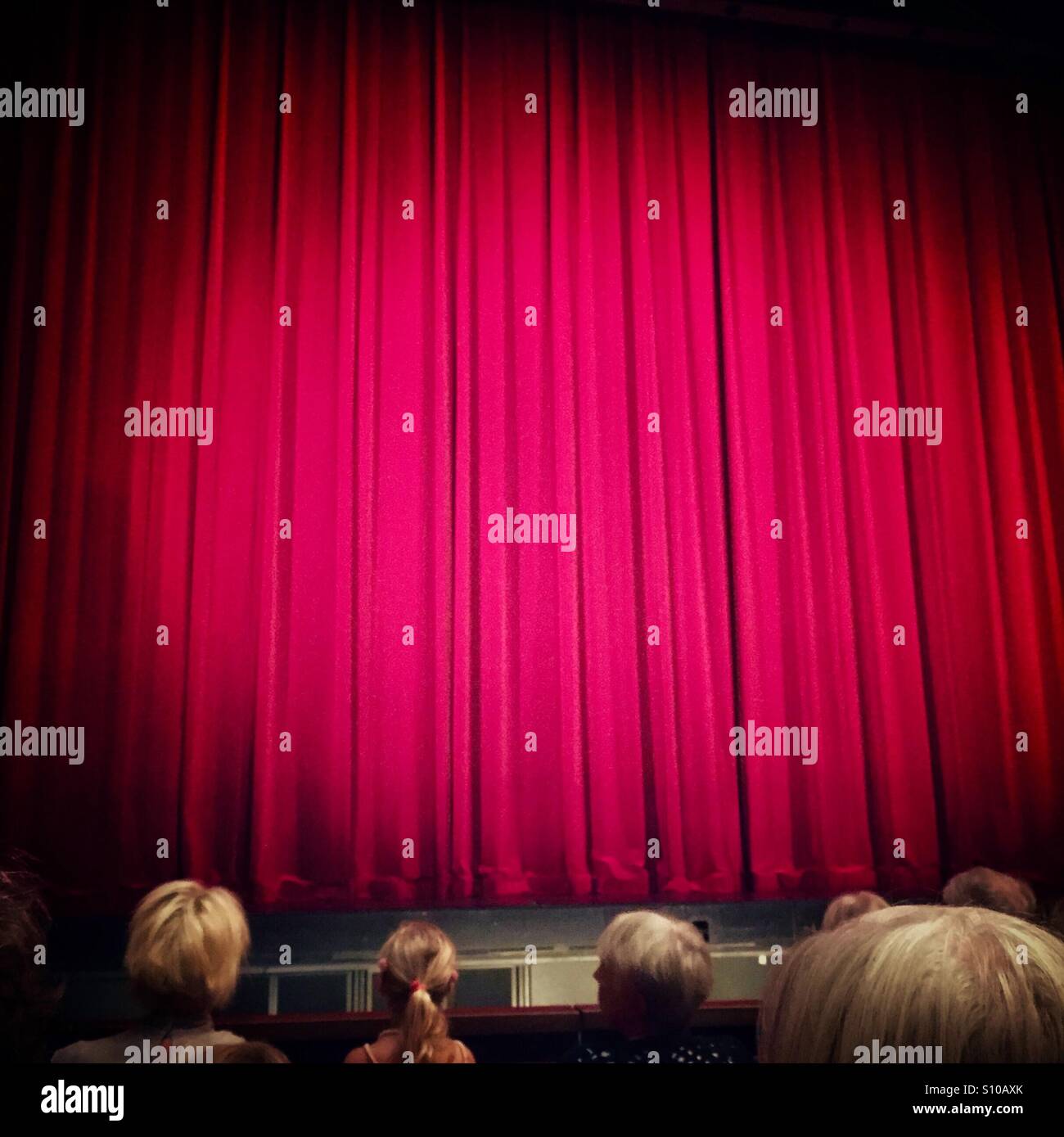 Red curtain in theatre Stock Photo