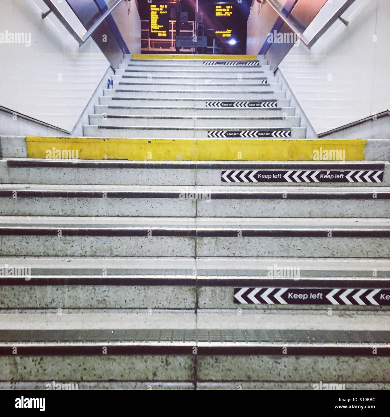 Keep Left signs in steps in the underground - Smartphone Captured Stock Image