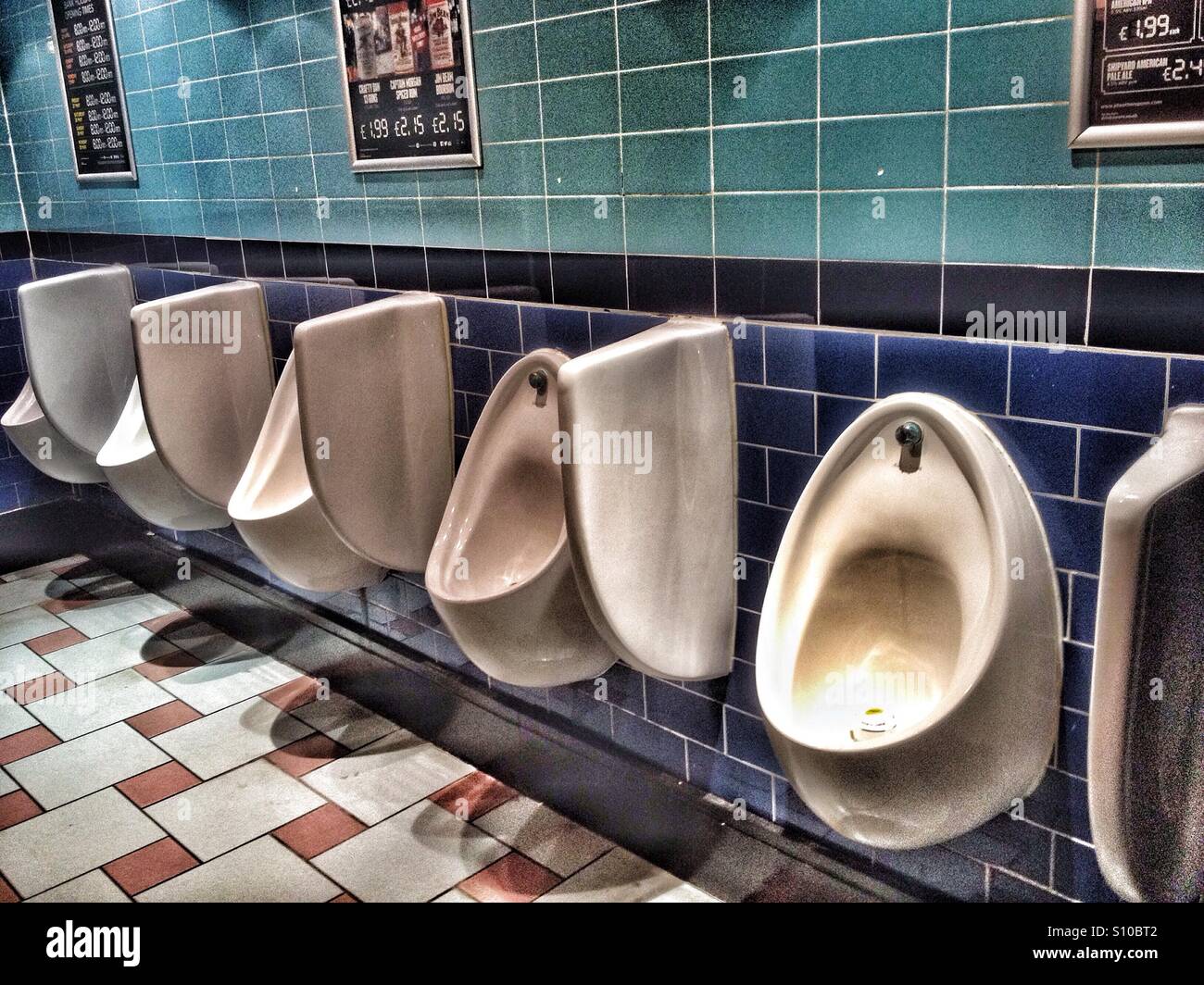 Urinals in a gents toilet Stock Photo - Alamy