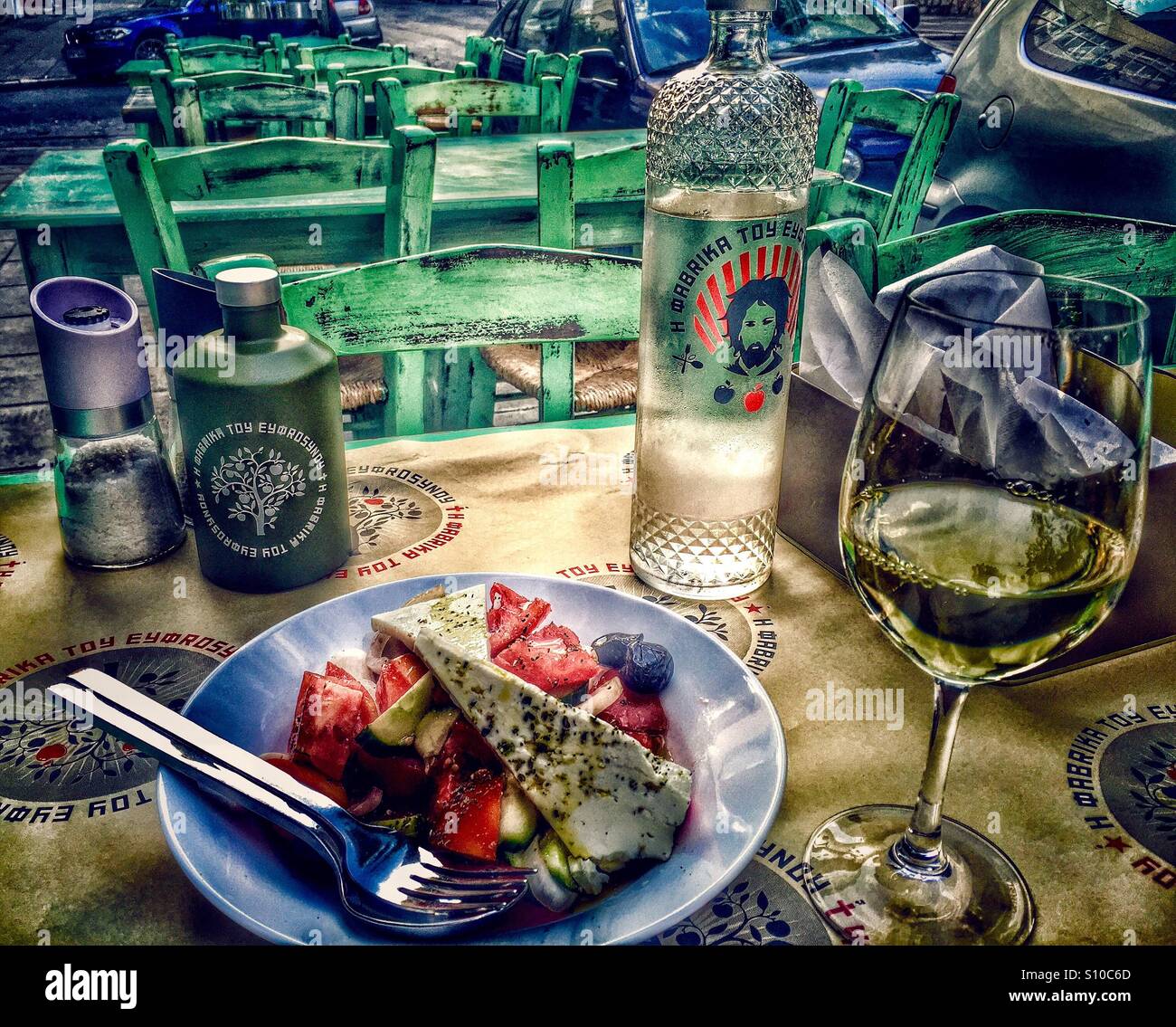 Greek salad with glass of a Greek wine Stock Photo