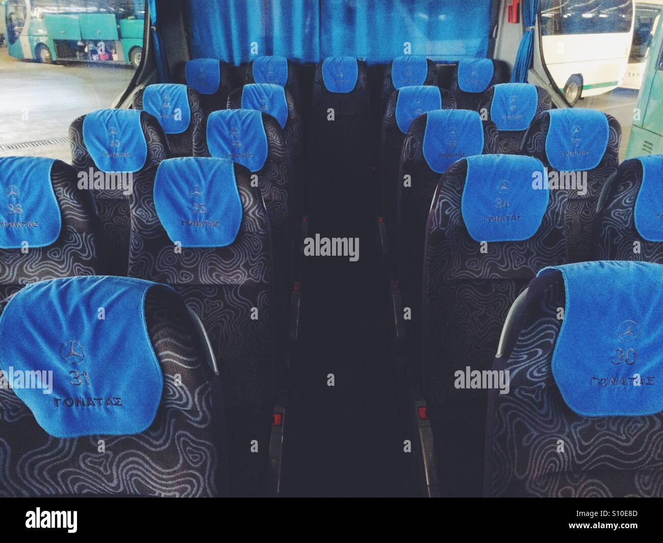 Empty seats on a coach bus in Greece. - Smartphone Captured Stock Image