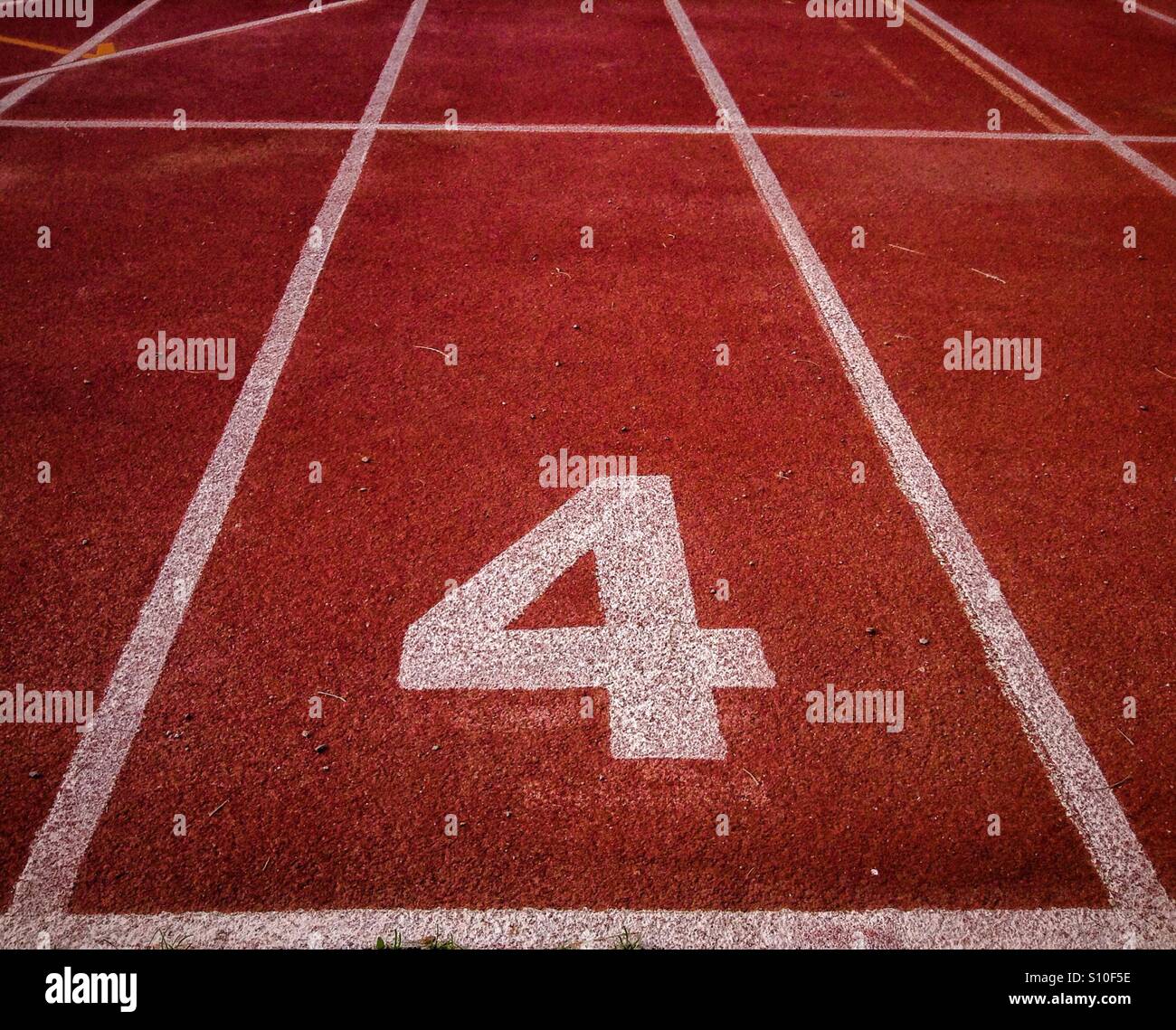 Number 4 on an athletics track Stock Photo - Alamy