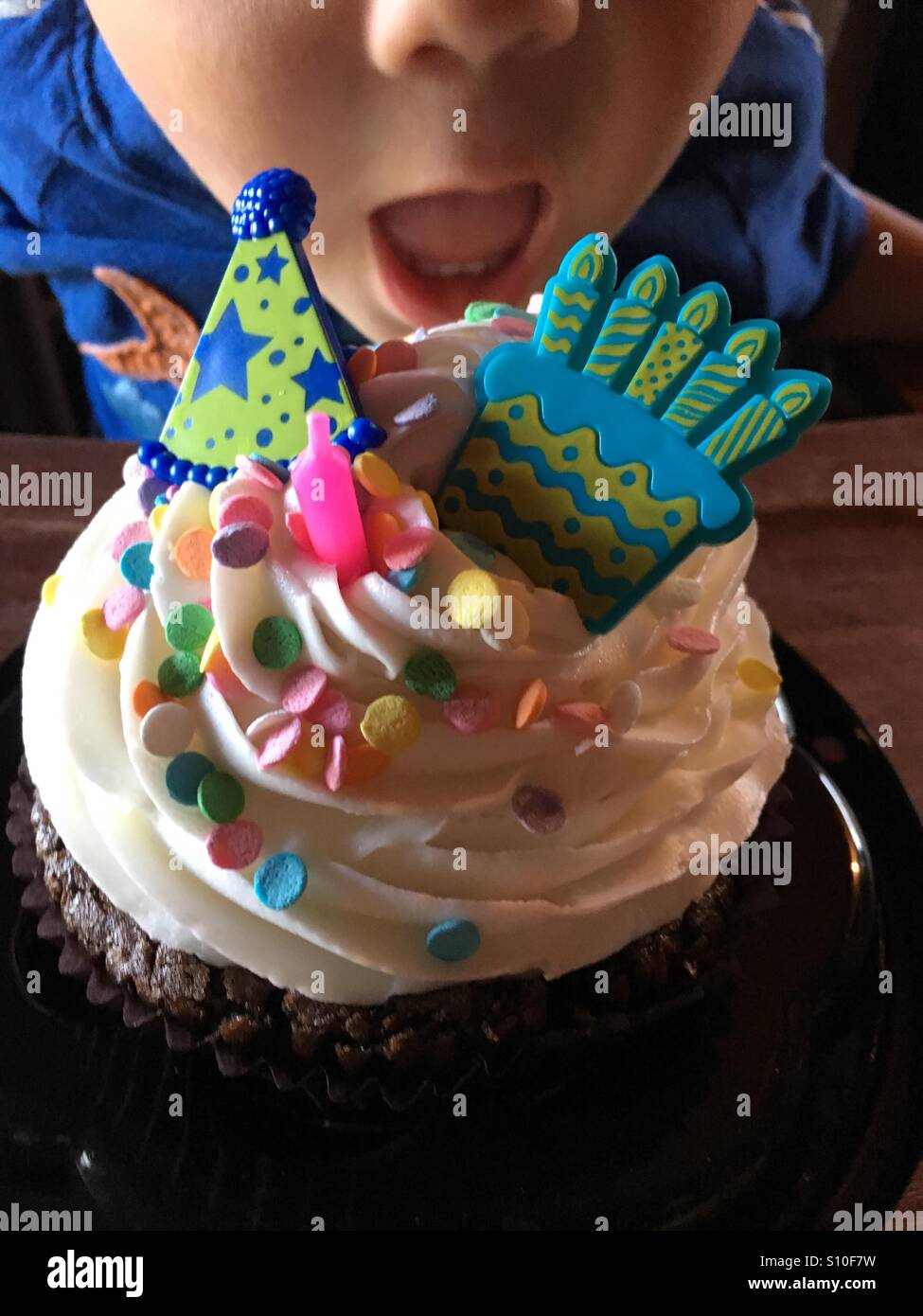 Taking a Bite of Birthday Cake Stock Photo