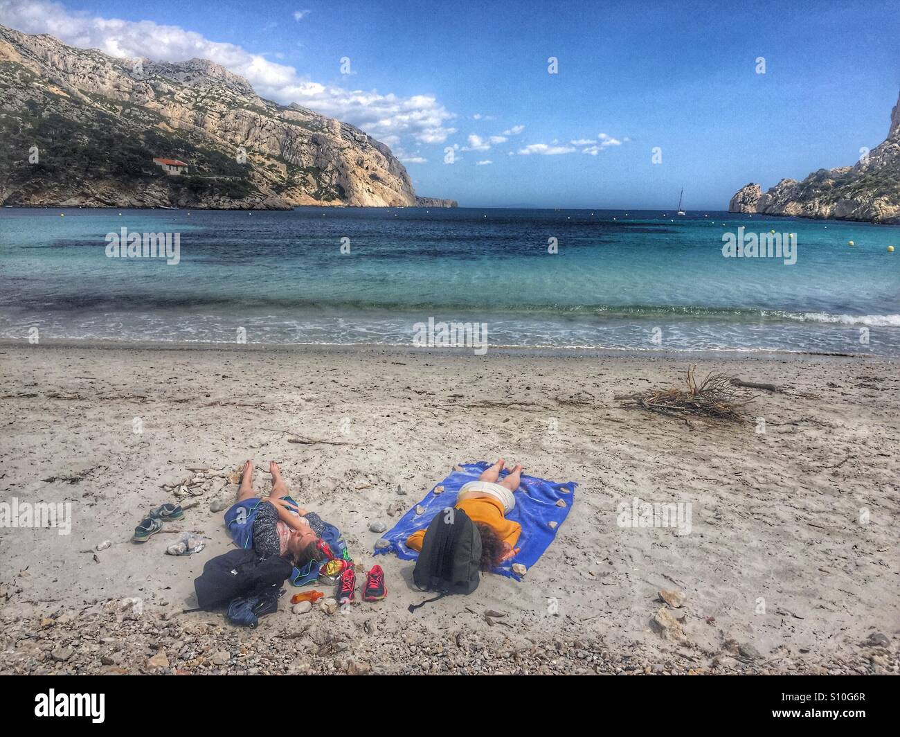 Two women relaxing on the beach, Les Calanques de Marseille France - Smartphone Captured Stock Image