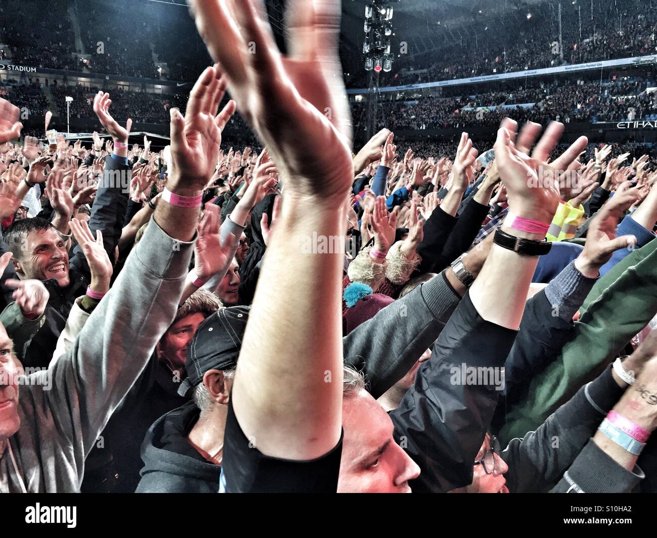 Fans wave their hands at a rock concert Stock Photo