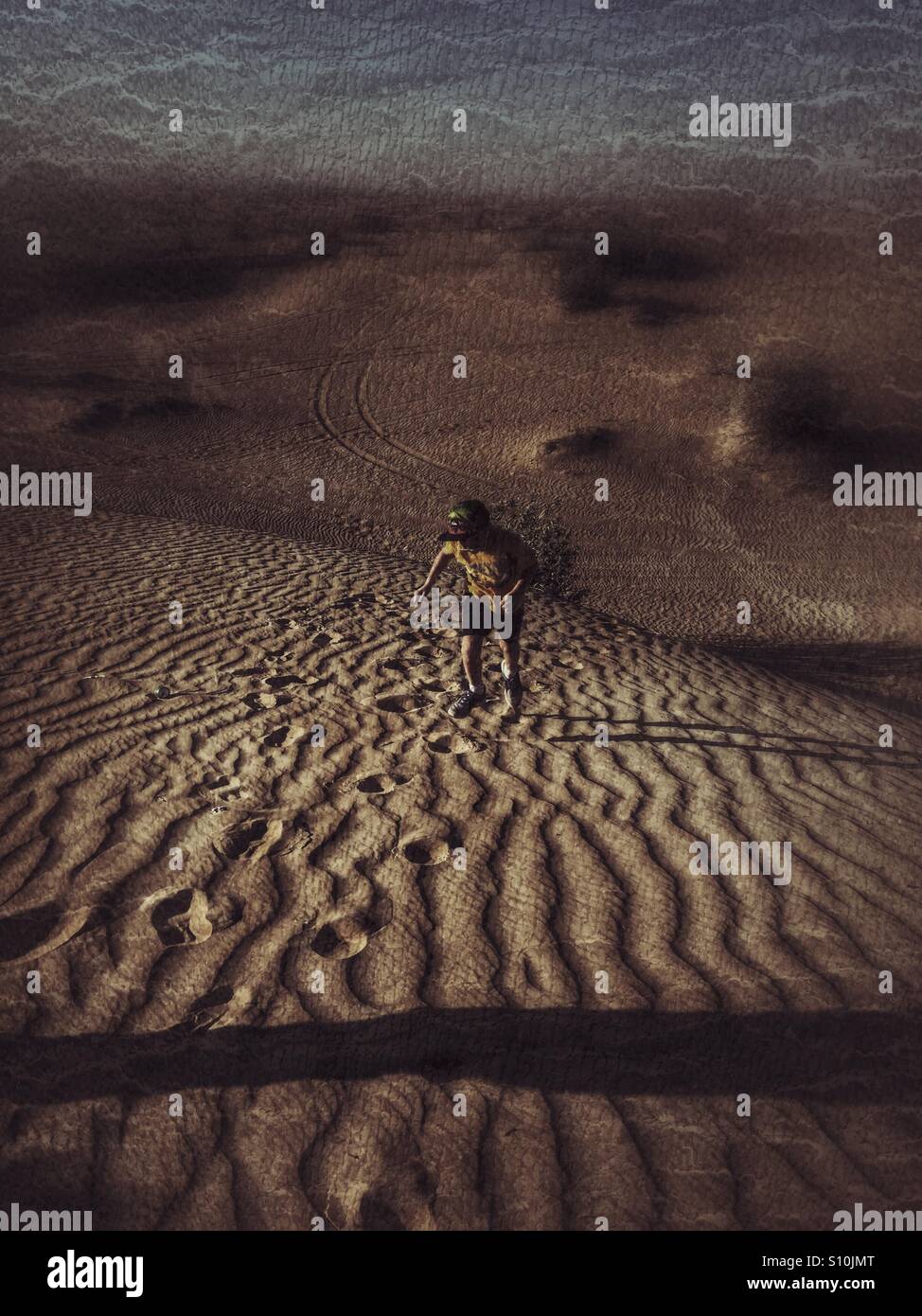 Boy wondering on desert sands - Smartphone Captured Stock Image