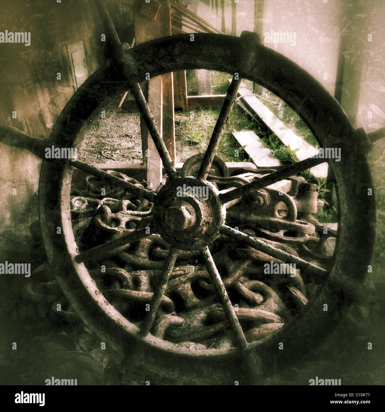 Old ship's wheel and anchor chain - Smartphone Captured Stock Image