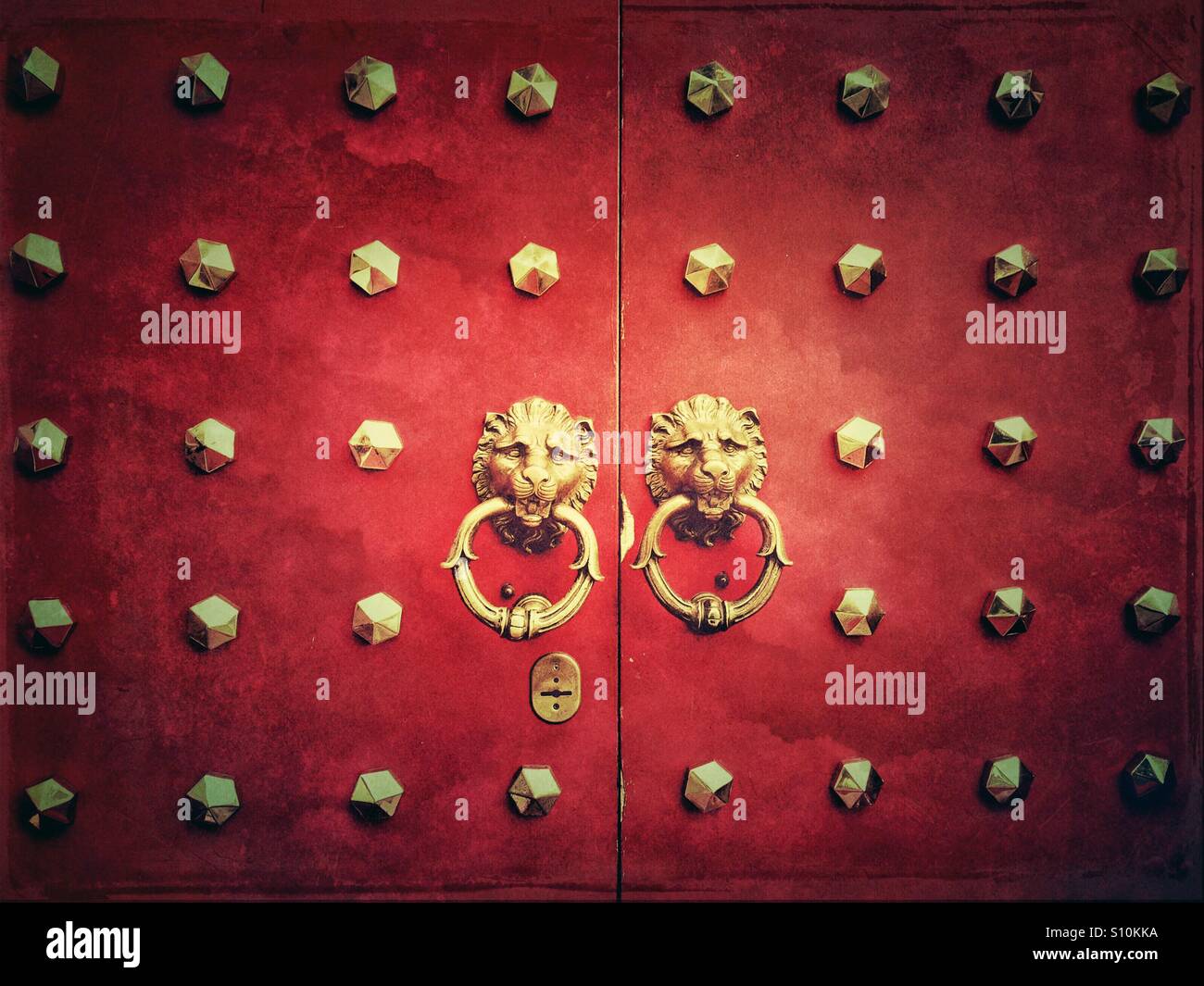 Traditional Chinese door with lion head's door knocker and ornamental studs - Smartphone Captured Stock Image