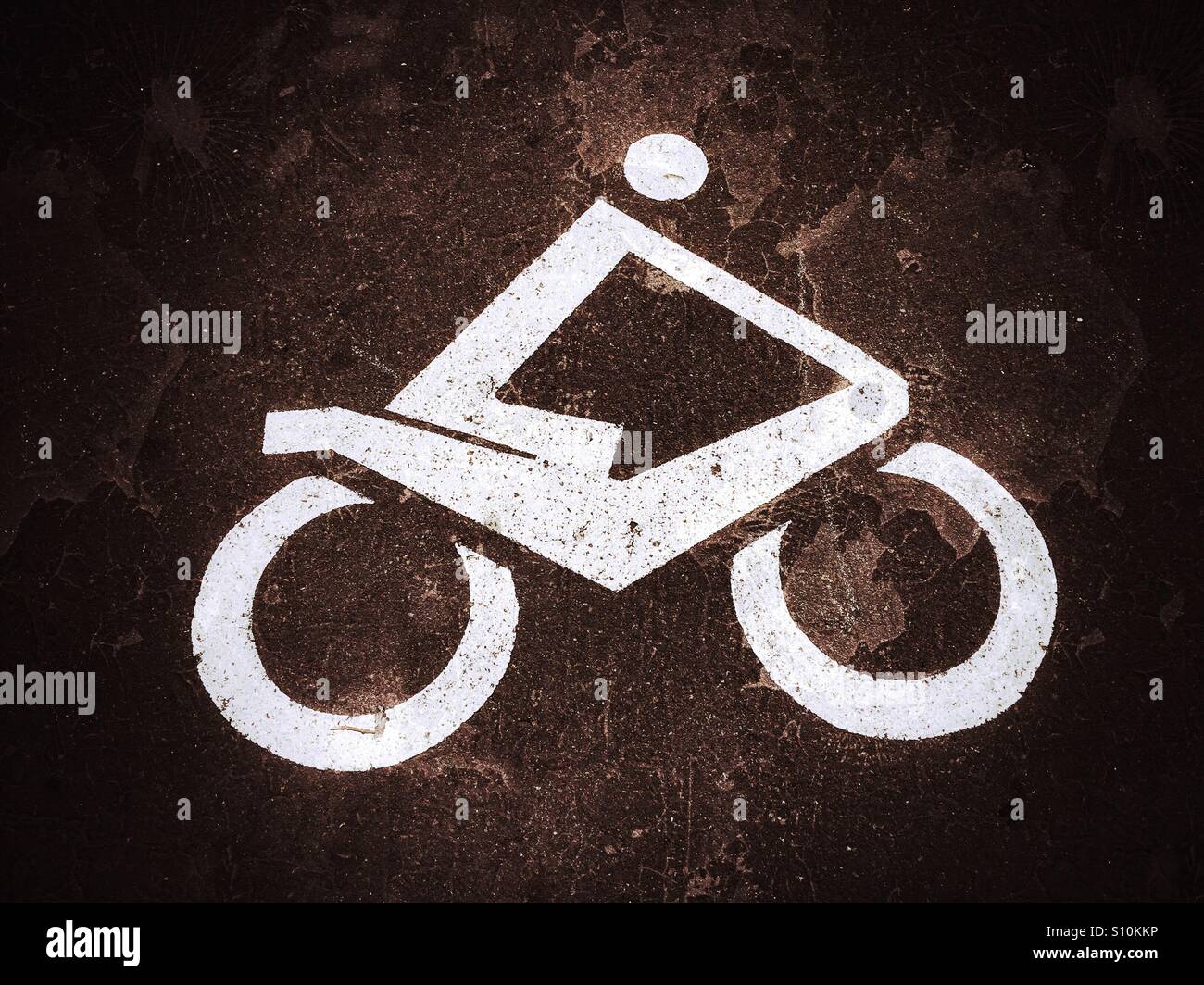 A Motorcycle Logo identifying an area specifically designated for the parking of Motorcycles or Motorbikes. A grunge and vignette effect added for visual interest. Photo Credit - © COLIN HOSKINS. - Smartphone Captured Stock Image