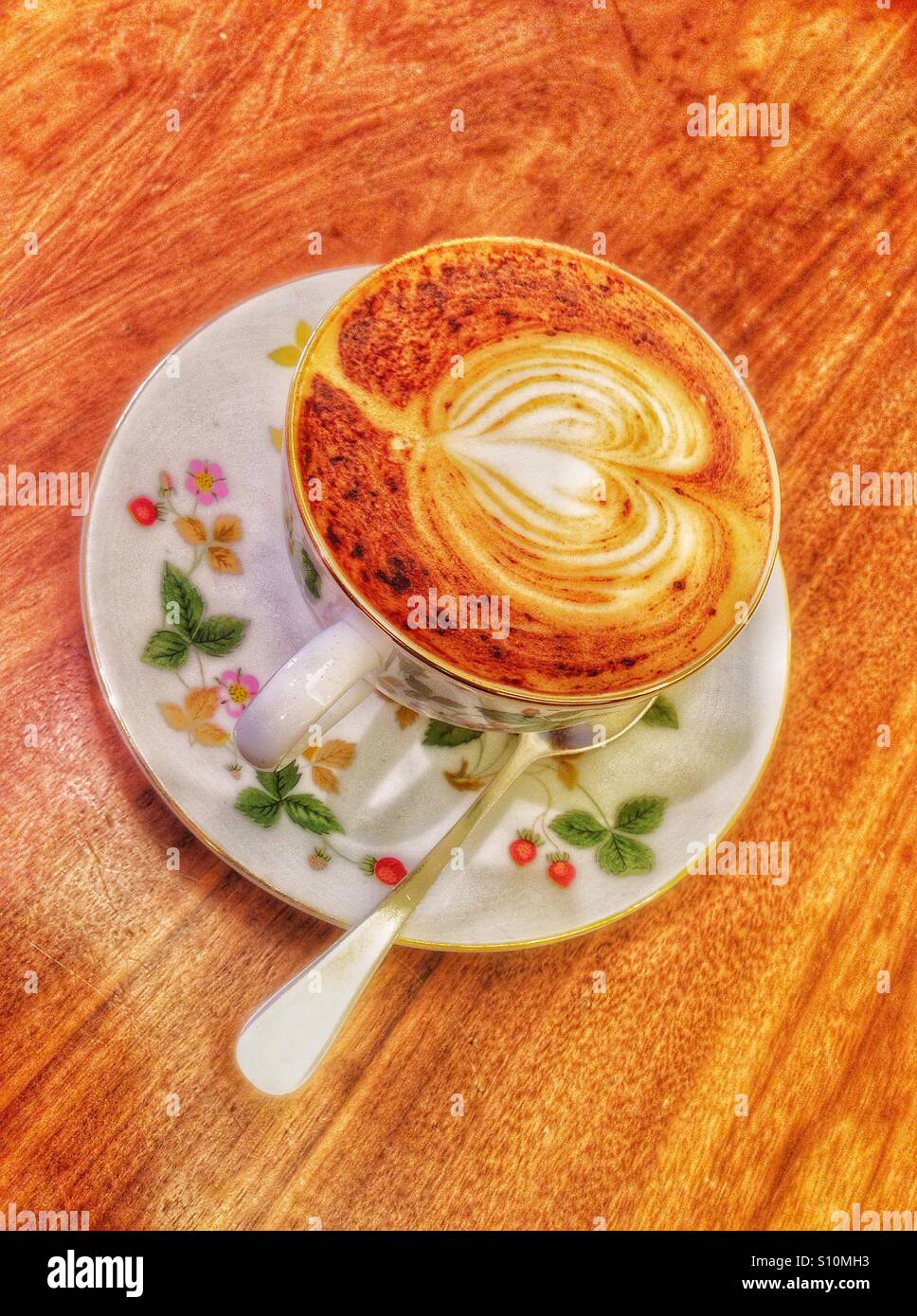 A cup of coffee in a floral cup Stock Photo Alamy